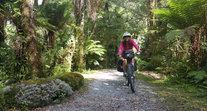 Judit riding towards Franz Joseph glacier lookout